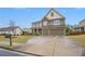 Beautiful two-story home featuring stone accents, a spacious front yard, and a double garage at 606 Discovery Ct, Acworth, GA 30102