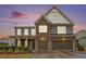 Charming two-story home with brick and siding, a two-car garage, and well-manicured landscaping at 606 Discovery Ct, Acworth, GA 30102