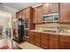 Spacious kitchen with stainless steel appliances, granite countertops, and ample cabinet space at 606 Discovery Ct, Acworth, GA 30102