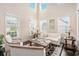 Bright and airy living room featuring high ceilings, large windows, and neutral décor at 606 Discovery Ct, Acworth, GA 30102