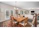 Cozy living space next to dining with fireplace, TV and comfortable seating at 606 Discovery Ct, Acworth, GA 30102