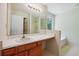 Clean bathroom with a large vanity and a separate tub and shower area at 6445 Marsham Dr, Atlanta, GA 30349