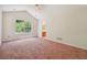 Bright bedroom featuring a large window with wooded views and neutral paint at 6445 Marsham Dr, Atlanta, GA 30349