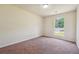Bright bedroom with a window, a closet and neutral-toned carpet at 6445 Marsham Dr, Atlanta, GA 30349