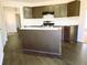 View of a kitchen featuring dark cabinets and wood floors at 6445 Marsham Dr, Atlanta, GA 30349