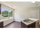 Bright eat-in kitchen with a view of backyard and laminate wood flooring at 6445 Marsham Dr, Atlanta, GA 30349