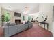 Bright living room featuring a fireplace, large windows, and an open floor plan at 6445 Marsham Dr, Atlanta, GA 30349