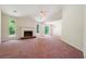 Inviting living room featuring a fireplace, large windows, and vaulted ceilings at 6445 Marsham Dr, Atlanta, GA 30349