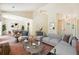 Cozy living room with vaulted ceilings, carpeted floors, and an open view to the dining area at 6445 Marsham Dr, Atlanta, GA 30349