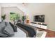 A relaxing bedroom featuring a bed, a TV, and large window at 6445 Marsham Dr, Atlanta, GA 30349