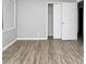 The bedroom boasts stylish floors, white-painted baseboards, and neutral walls, enhanced by a window at 6884 Stephens Dr, Rex, GA 30273