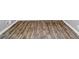 Stylish wood-look flooring with a white-painted baseboard and light-gray walls create an open feeling at 6884 Stephens Dr, Rex, GA 30273