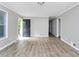 Inviting living room featuring new flooring, fresh paint, and plenty of natural light at 6884 Stephens Dr, Rex, GA 30273