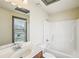 Clean bathroom features a vanity with a sink, a large mirror, and a shower-tub combo at 9942 Ashton Old Rd, Douglasville, GA 30135