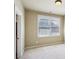 Inviting bedroom with soft carpeting and large window, offering a peaceful retreat at 9942 Ashton Old Rd, Douglasville, GA 30135
