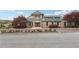 Community clubhouse boasts charming architecture, manicured landscaping, and a welcoming entrance at 9942 Ashton Old Rd, Douglasville, GA 30135