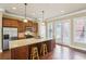 Well-lit kitchen with stainless steel appliances, granite countertops, and an island with barstool seating at 9942 Ashton Old Rd, Douglasville, GA 30135