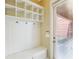 Mudroom features a built-in storage bench with cubbies and hooks, providing a convenient drop zone at 9942 Ashton Old Rd, Douglasville, GA 30135