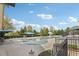 Community pool surrounded by green trees and lounge furniture, perfect for summertime relaxation at 9942 Ashton Old Rd, Douglasville, GA 30135