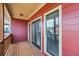 Covered porch with natural light featuring three large windows with a view to the street at 9942 Ashton Old Rd, Douglasville, GA 30135