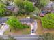 A high aerial shot of the residence with a driveway and flourishing flora in a quiet neighborhood at 126 Washington St, Mcdonough, GA 30253