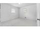 Bright bedroom with tile flooring, neutral walls, and windows with blinds at 126 Washington St, Mcdonough, GA 30253