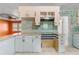 Kitchen featuring countertop space, vintage tile, and cabinetry at 126 Washington St, Mcdonough, GA 30253