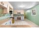Vintage kitchen offering tile, cabinets, and a sink with storage at 126 Washington St, Mcdonough, GA 30253