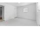Unfurnished room with white tile flooring, white walls, and a window at 126 Washington St, Mcdonough, GA 30253