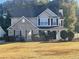 Charming two-story home with a brick and siding facade and well-manicured landscaping at 2013 Reserve Pkwy, Mcdonough, GA 30253