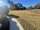 View of a large green front yard on a sunny day at 2013 Reserve Pkwy, Mcdonough, GA 30253