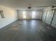 View of empty garage with two windows and automatic garage door at 2013 Reserve Pkwy, Mcdonough, GA 30253