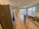 Bright kitchen with stainless steel appliances, granite countertops, and ample counter space at 2013 Reserve Pkwy, Mcdonough, GA 30253
