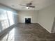 Bright living room with a fireplace, ample natural light, and wood floors at 2013 Reserve Pkwy, Mcdonough, GA 30253