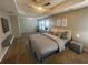 Spacious primary bedroom with a tray ceiling, large windows, and neutral decor at 2013 Reserve Pkwy, Mcdonough, GA 30253