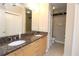 Bathroom featuring granite counters, double sinks, and tiled floors at 265 18Th Nw St # 2329, Atlanta, GA 30363