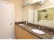 Bathroom featuring granite counters, double sinks, and a laundry area at 265 18Th Nw St # 2329, Atlanta, GA 30363