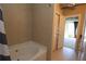 Clean bathroom featuring neutral tiling, and shower over tub combination at 265 18Th Nw St # 2329, Atlanta, GA 30363