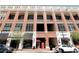 Brick building with retail stores on ground floor and parking in a covered garage at 265 18Th Nw St # 2329, Atlanta, GA 30363