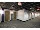 Hallway featuring an open concept ceiling, patterned carpet, apartment doors and exit signs at 265 18Th Nw St # 2329, Atlanta, GA 30363