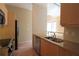 Well-lit kitchen features granite countertops, stainless steel appliances, and blonde wood cabinetry at 265 18Th Nw St # 2329, Atlanta, GA 30363