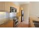 Modern kitchen features stainless steel appliances and light wood cabinetry at 265 18Th Nw St # 2329, Atlanta, GA 30363