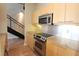 Updated kitchen with stainless steel appliances and modern staircase at 265 18Th Nw St # 2329, Atlanta, GA 30363