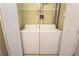 Convenient laundry area with full size washer and dryer, and storage shelf at 265 18Th Nw St # 2329, Atlanta, GA 30363