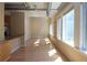 Living area with hardwood floors and lots of windows offering plenty of natural light with metallic ductwork on ceiling at 265 18Th Nw St # 2329, Atlanta, GA 30363
