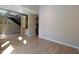 Bright living room with hardwood floors, open floor plan, and modern, industrial-style ductwork at 265 18Th Nw St # 2329, Atlanta, GA 30363
