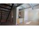 View of living room from staircase featuring open layout, hardwood flooring, and a modern design with metallic ductwork at 265 18Th Nw St # 2329, Atlanta, GA 30363