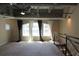 Living room with ceiling fan and three windows dressed with long curtains, adding natural light and style at 265 18Th Nw St # 2329, Atlanta, GA 30363