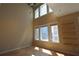 Bright, open living room with hardwood floors, tall ceilings, and large windows at 265 18Th Nw St # 2329, Atlanta, GA 30363