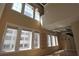 High-ceilinged living room with large windows, hardwood floors, and metallic ductwork with a modern look at 265 18Th Nw St # 2329, Atlanta, GA 30363